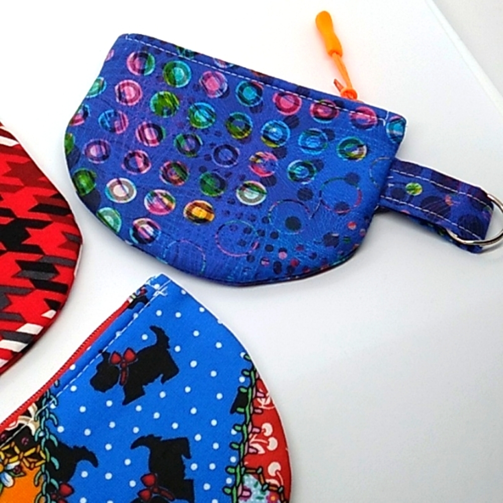Interfaced, lined, reinforced seams throughout the coin pouches.